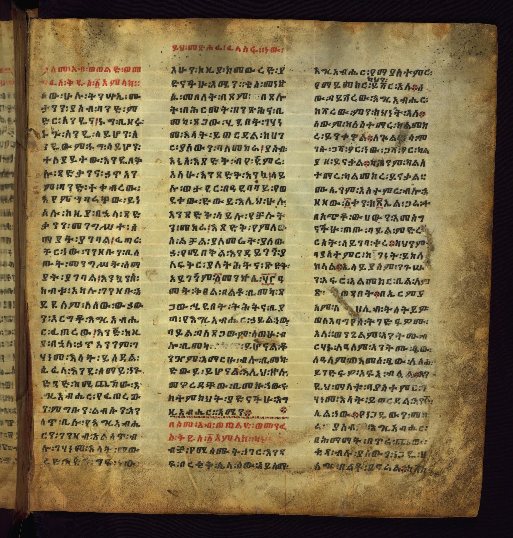 Three-column Ge'ez manuscript with rubrics